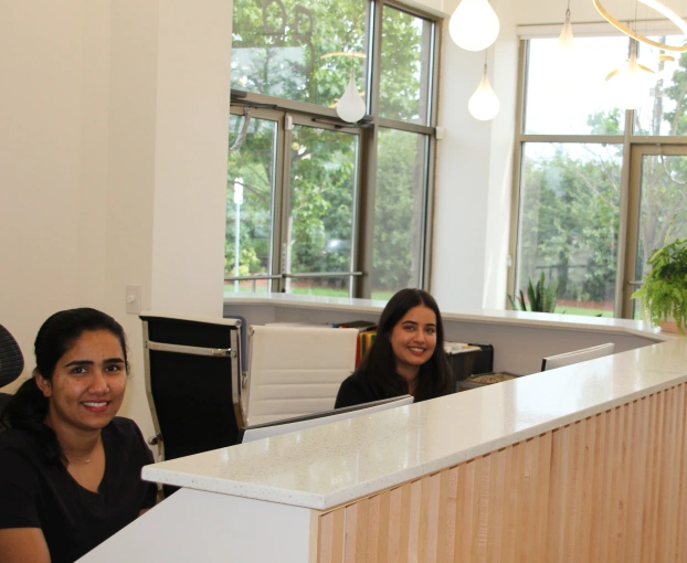 Team member sitting at reception desk